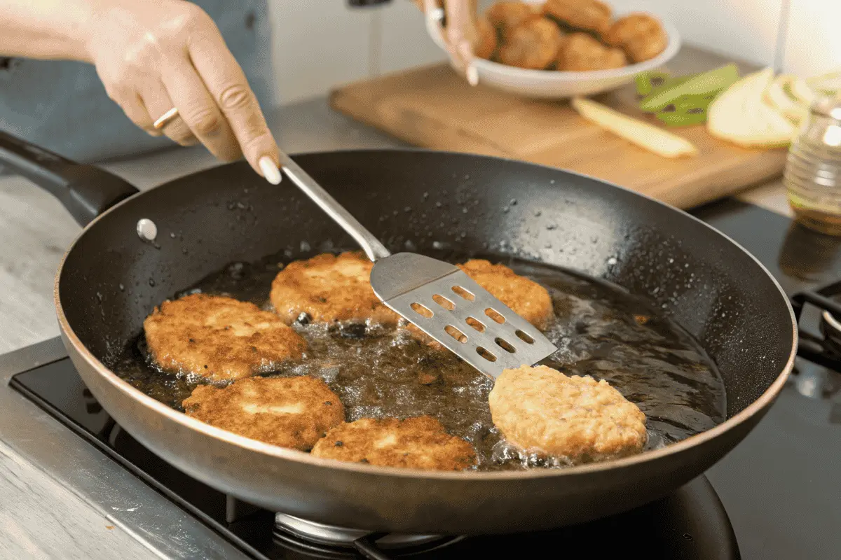 Draining excess oil from chicken fritters